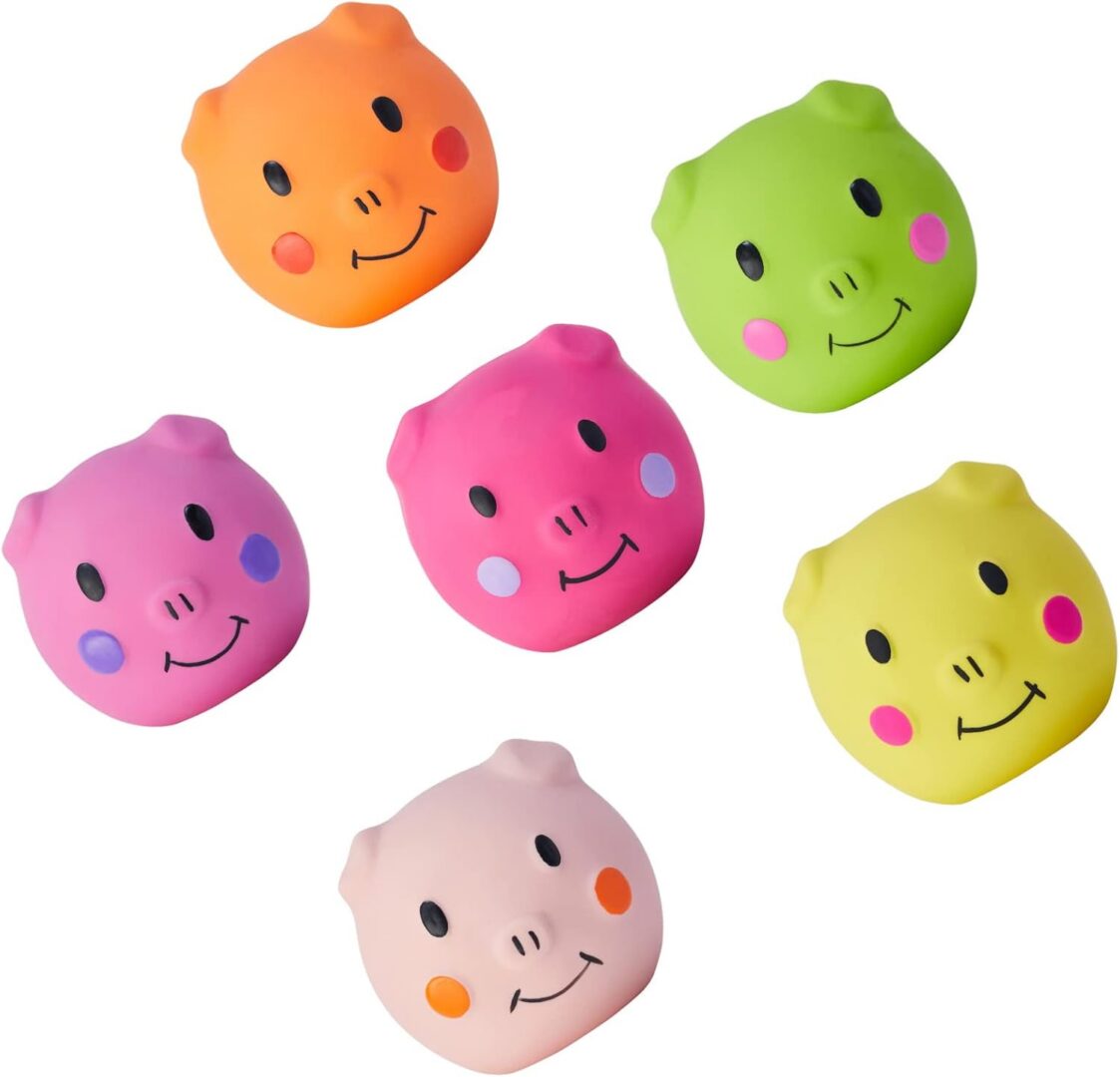 Colorful pig face stress balls arranged together.