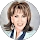 Smiling woman with short hair and bangs.
